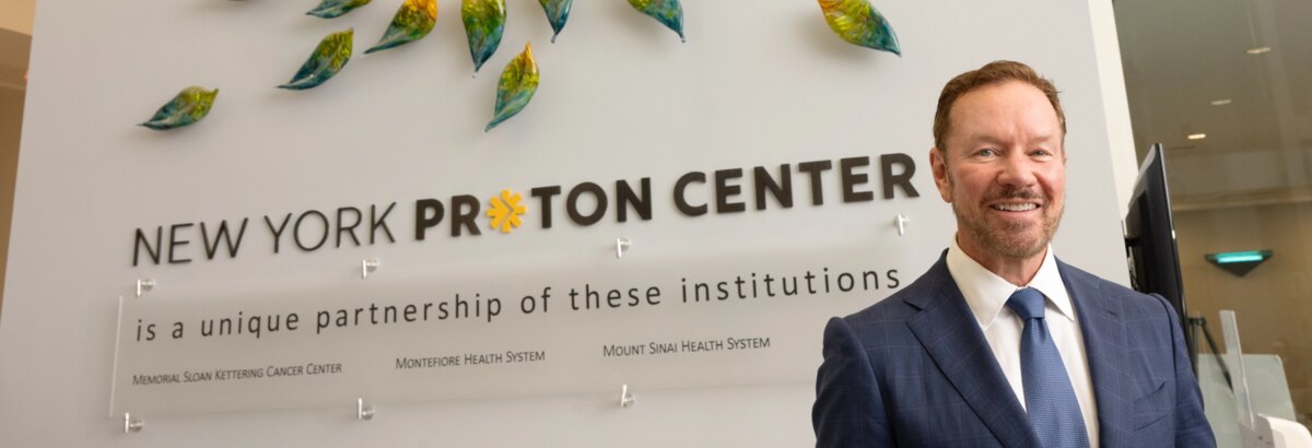 Christopher Panczner, CEO, New York Proton Center, poses in the lobby with a welcoming smile.