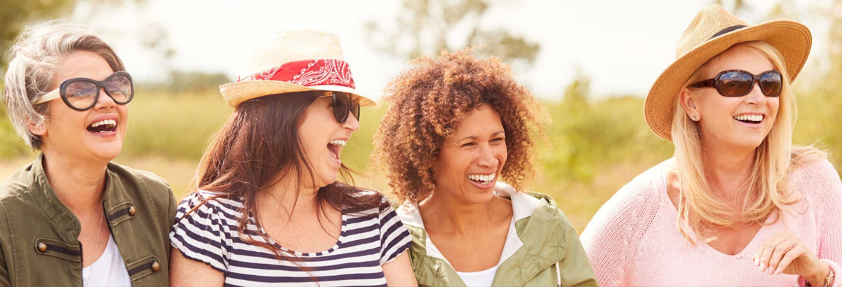 Four happy women outdoors